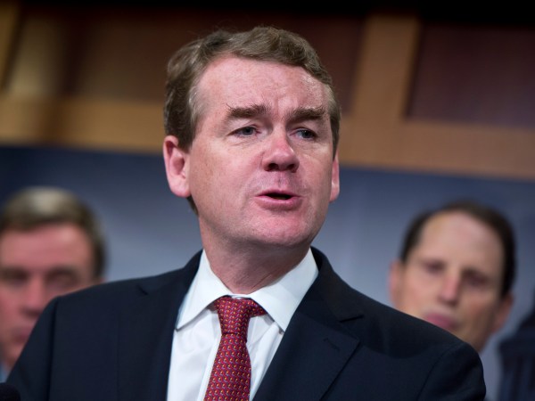 UNITED STATES - OCTOBER 01: Sen. Michael Bennet, D-Colo., speaks during a news conference in the Capitol's Senate studio, October 1, 2015, to introduce the Iran Policy Oversight Act of 2015. Sens. Mark Warner, D-Va., left, and Ron Wyden, D-Ore., also appear. (Photo By Tom Williams/CQ Roll Call)