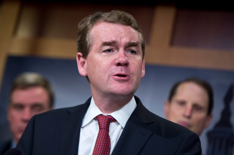 UNITED STATES - OCTOBER 01: Sen. Michael Bennet, D-Colo., speaks during a news conference in the Capitol's Senate studio, October 1, 2015, to introduce the Iran Policy Oversight Act of 2015. Sens. Mark Warner, D-Va., left, and Ron Wyden, D-Ore., also appear. (Photo By Tom Williams/CQ Roll Call)