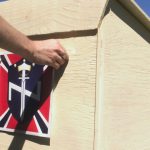 SCOTTSBORO, AL - SEPTEMBER 18: An Aryan Nations member puts the final touches on a the podium that will be used for speakers at the Aryan Nations sponsored White Heritage Days Festival September 18, 2004, which was held on private land near Scottsboro, Alabama. The event was originally scheduled as a pro-white family-friendly gathering, yet also served as an East Coast memorial to Pastor Richard G. Butler, the Aryan Nations founder who died about two weeks earlier at his home in Coure D'Alene, Idaho. The family-friendly event was attended by over 100 people, including members of Aryan Nations, White Revolution, the Ku Klux Klan and several independent, but racially conscious people. (Photo by David S. Holloway/Getty Images)