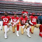SANTA CLARA, CA - DECEMBER 24: Eli Harold #57, Eric Reid #35, Marquise Goodwin #11 and Louis Murphy #18 of the San Francisco 49ers kneel on the sideline as Adrian Colbert #38 stands with them in solidarity, during the anthem, prior to the game against the Jacksonville Jaguars at Levi's Stadium on December 24, 2017 in Santa Clara, California. The 49ers defeated the Jaguars 44-33. (Photo by Michael Zagaris/San Francisco 49ers/Getty Images)  *** Local Caption *** Eli Harold;Eric Reid;Marquise Goodwin;Louis Murphy;Adrian Colbert