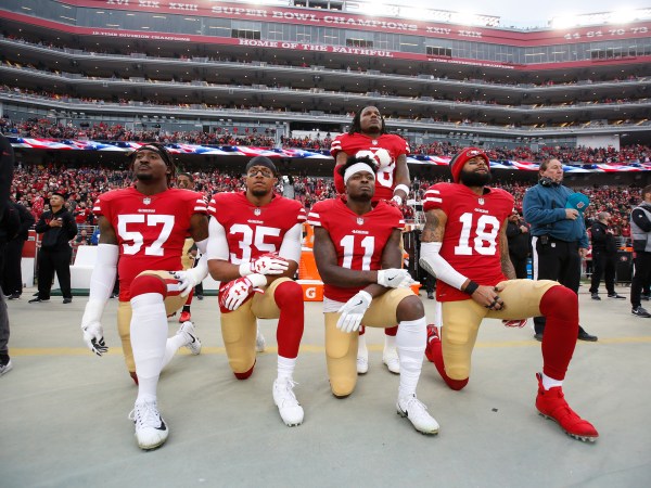 SANTA CLARA, CA - DECEMBER 24: Eli Harold #57, Eric Reid #35, Marquise Goodwin #11 and Louis Murphy #18 of the San Francisco 49ers kneel on the sideline as Adrian Colbert #38 stands with them in solidarity, during the anthem, prior to the game against the Jacksonville Jaguars at Levi's Stadium on December 24, 2017 in Santa Clara, California. The 49ers defeated the Jaguars 44-33. (Photo by Michael Zagaris/San Francisco 49ers/Getty Images)  *** Local Caption *** Eli Harold;Eric Reid;Marquise Goodwin;Louis Murphy;Adrian Colbert