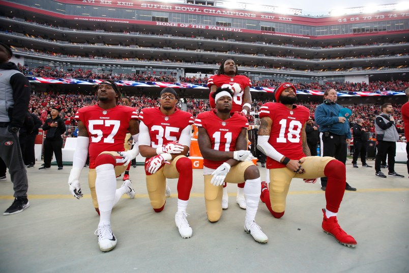 SANTA CLARA, CA - DECEMBER 24: Eli Harold #57, Eric Reid #35, Marquise Goodwin #11 and Louis Murphy #18 of the San Francisco 49ers kneel on the sideline as Adrian Colbert #38 stands with them in solidarity, during the anthem, prior to the game against the Jacksonville Jaguars at Levi's Stadium on December 24, 2017 in Santa Clara, California. The 49ers defeated the Jaguars 44-33. (Photo by Michael Zagaris/San Francisco 49ers/Getty Images)  *** Local Caption *** Eli Harold;Eric Reid;Marquise Goodwin;Louis Murphy;Adrian Colbert
