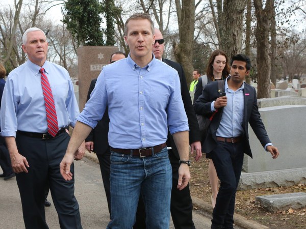 Vice President Mike Pence and Missouri Gov. Eric Greitens walk through the Chesed Shel Emeth Cemetery in University City, Mo., on Wednesday, Feb. 22, 2017. A St. Louis County attorney filed a lawsuit last week accusing Gov. Eric Greitens and his staff of engaging in an ongoing conspiracy to violate Missouri's open records laws by using an app that deletes text messages after they've been read. (J.B. Forbes/St. Louis Post-Dispatch/TNS)