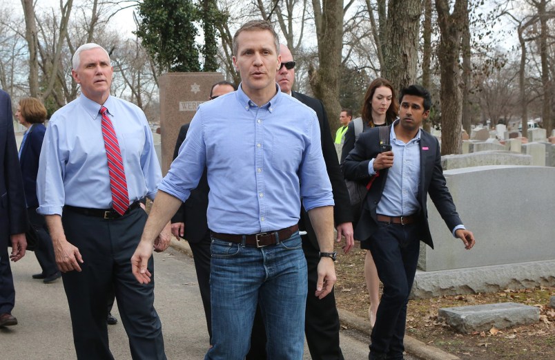 Vice President Mike Pence and Missouri Gov. Eric Greitens walk through the Chesed Shel Emeth Cemetery in University City, Mo., on Wednesday, Feb. 22, 2017. A St. Louis County attorney filed a lawsuit last week accusing Gov. Eric Greitens and his staff of engaging in an ongoing conspiracy to violate Missouri's open records laws by using an app that deletes text messages after they've been read. (J.B. Forbes/St. Louis Post-Dispatch/TNS)