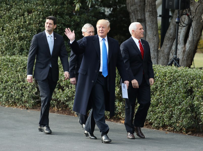 U.S. President Donald Trump, flanked by Republican lawmakers, celebrates Congress passing the Tax Cuts and Jobs Act with Republican members of the House and Senate on the South Lawn of the White House on December 20, 2017 in Washington, DC. The tax bill is the first major legislative victory for the GOP-controlled Congress and Trump since he took office almost one year ago.