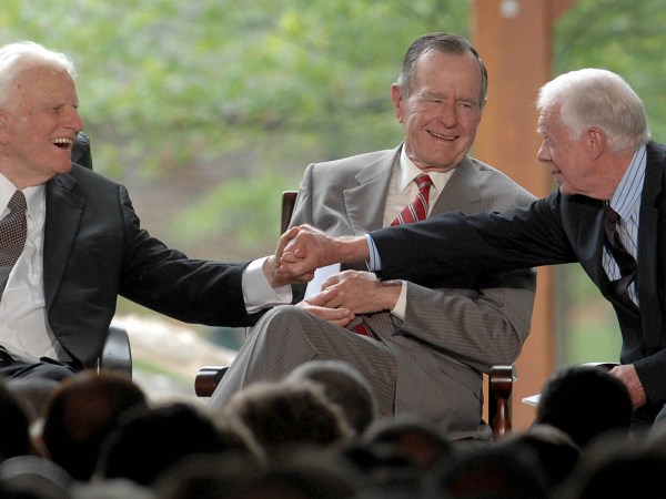 Billy Graham shakes hands with Billy Carter at the dedication ceremony for the Billy Graham Library in Charlotte, North Carolina, Thursday, May 31, 2007. (Todd Sumlin/Charlotte Observer/MCT)