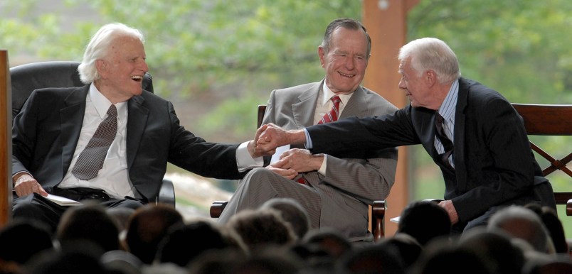 Billy Graham shakes hands with Billy Carter at the dedication ceremony for the Billy Graham Library in Charlotte, North Carolina, Thursday, May 31, 2007. (Todd Sumlin/Charlotte Observer/MCT)