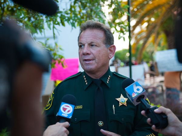 2015 June 23 Broward County Sheriff Scott Israel.  Local activitists in Fort Lauderdale, Florida lead a rally to commemorate the lives of the nine black churchgoers who lost their lives.  With our nation grappling over racist violence., local activist groups include Dream Defenders and People's Opposition to War, Imperialism, and Racism ( or POWIR) came together with members of the community.  Candles were lit and the group walked to a near by church to pray.