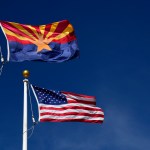 CANYON DE CHELLY, AZ - MARCH 18, 2017:  The Arizona state flag flies beside the United States flag at the Visitor Center at Canyon de Chelly National Monument near Chinle, Arizona. Established in 1931, the monument is jointly managed by the National Park Service and the Navajo Nation. The monument is entirely on Navajo tribal lands in northeastern Arizona. (Photo by Robert Alexander/Getty Images)