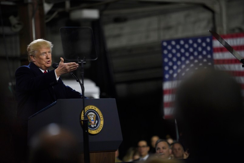 CORAOPOLIS, PA - JANUARY 18: President Donald Trump speaks to supporters at a rally at H&K Equipment, a rental and sales company for specialized material handling solutions on January 18, 2018 in Coraopolis, Pennsylvania. Trump visited the facility for a factory tour and to offer remarks to supporters and employees following the administration's new tax plan. (Photo by Jeff Swensen/Getty Images)