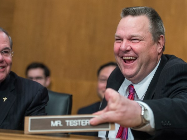 UNITED STATES - JANUARY 23: Sens. Bob Menendez, D-N.J., and Jon Tester, D-Mont., are seen during a Senate Banking, Housing and Urban Affairs Committee hearing in Dirksen Building on the nominations of Jelena McWilliams, Marvin Goodfriend, and Thomas Workman on January 23, 2018. (Photo By Tom Williams/CQ Roll Call)