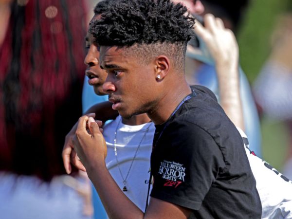 Students are released from a lockdown outside of Stoneman Douglas High School in Parkland, Fla. after reports of an active shooter on Wednesday, Feb. 14, 2018. (John McCall/Sun Sentinel/TNS)