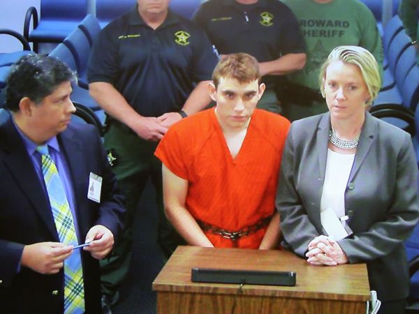 Nikolas Cruz, 19, a former student at Marjory Stoneman Douglas High School in Parkland, Florida, where he allegedly killed 17 people, is seen on a closed circuit television screen during a bond  hearing in front of Broward Judge Kim Mollica at the Broward County Courthouse on February 15, 2018 in Fort Lauderdale, Florida. Mr. Cruz is possibly facing 17 counts of premeditated murder in the school shooting.