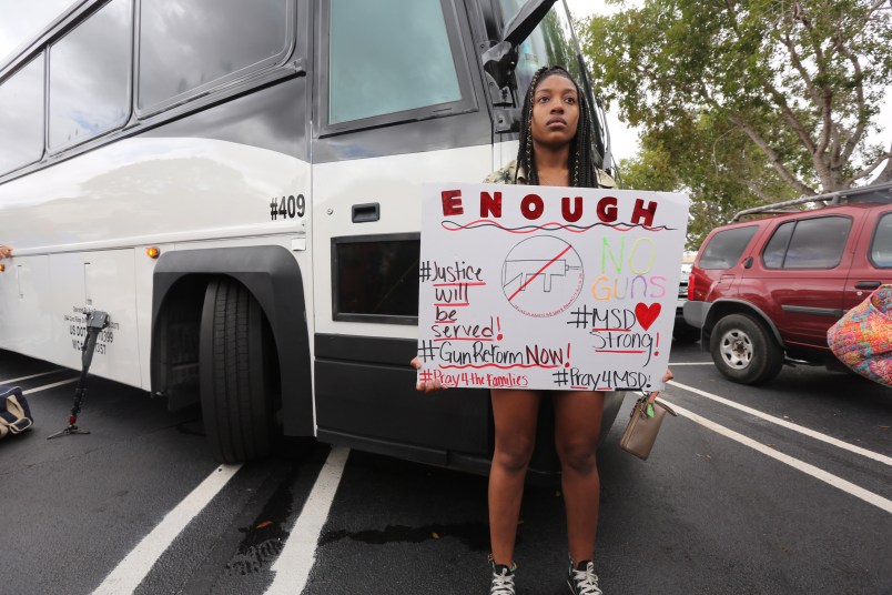 A Stoneman Douglas student waits to board buses to Tallahassee, Fla., heading to the Florida Capitol to advocate for gun control on Tuesday, February 20, 2018. (Emily Michot/Miami Herald/TNS)