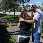 Azra, left, and Unser Khan of Parkland grieve outside of Marjory Stoneman Douglas High School in Parkland, Thursday, Feb. 15, 2018. The family's adult children are both graduates of the school. (Joe Cavaretta/Sun Sentinel/TNS)