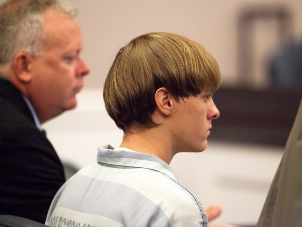 Dylann Roof (R), the 21-year-old man charged with murdering nine worshippers at a historic black church in Charleston last month, listens to the proceedings with assistant defense attorney William Maguire during a hearing at the Judicial Center in Charleston, South Carolina July 16, 2015.   REUTERS/Randall Hill