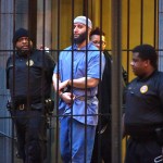Officials escort "Serial" podcast subject Adnan Syed from the courthouse following the completion of the first day of hearings for a retrial in Baltimore on Wednesday, Feb. 3, 2016. (Karl Merton Ferron/Baltimore Sun/TNS)