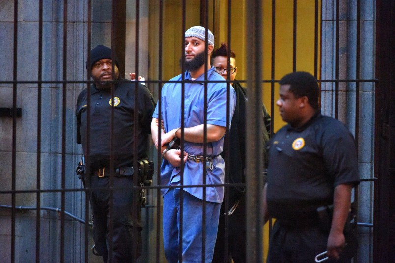 Officials escort "Serial" podcast subject Adnan Syed from the courthouse following the completion of the first day of hearings for a retrial in Baltimore on Wednesday, Feb. 3, 2016. (Karl Merton Ferron/Baltimore Sun/TNS)