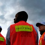 Baylen, Liz –– – LOS ANGELES, CA – MARCH 30, 2010 (Middle) Shamar Drew, 30, of LA, and (right) David Brown, 67, of LA, say working as enumerators for the Census is something fun to do and it also allows them to make a little extra money. They are among many Census workers, who picked up materials at Dodger Stadium before heading out to count the number of homeless people, March 30, 2010, in Los Angeles. ( Liz O. Baylen / Los Angeles Times )