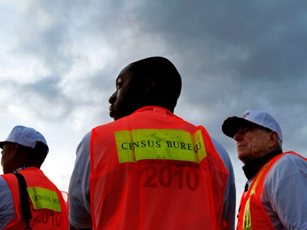 Baylen, Liz –– – LOS ANGELES, CA – MARCH 30, 2010 (Middle) Shamar Drew, 30, of LA, and (right) David Brown, 67, of LA, say working as enumerators for the Census is something fun to do and it also allows them to make a little extra money. They are among many Census workers, who picked up materials at Dodger Stadium before heading out to count the number of homeless people, March 30, 2010, in Los Angeles. ( Liz O. Baylen / Los Angeles Times )