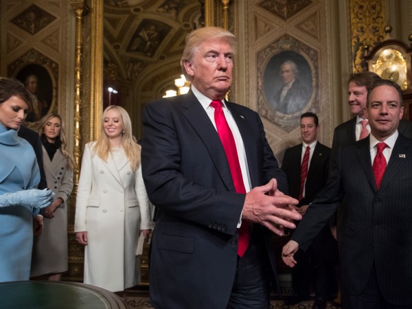 President Donald Trump leaves the President’s Room of the Senate at the Capitol after he formally signed his cabinet nominations into law, in Washington, Friday, Jan. 20, 2017. He is joined by his wife Melania Trump and  and daughter Tiffany Trump. At far right is Chief of Staff Reince Priebus, with White House counsel Donald McGahn, second from right. (AP Photo/J. Scott Applewhite, Pool)