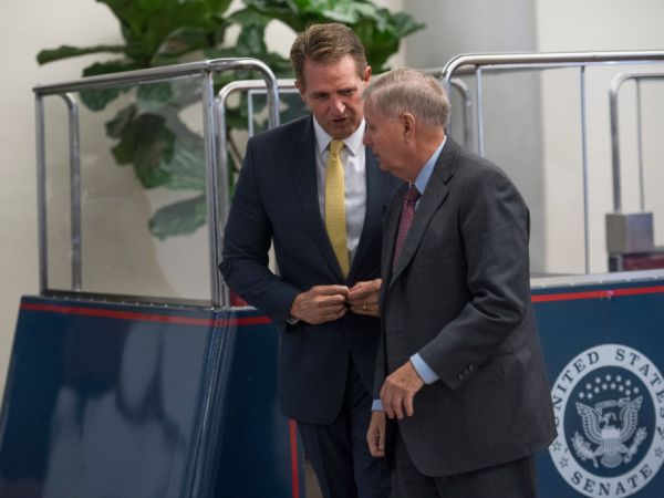 UNITED STATES - SEPTEMBER 07: Sens. Jeff Flake, R-Ariz., left, and Lindsey Graham, R-S.C., make their way to a Hurricane Harvey aid related vote in the Capitol on September 7, 2017. (Photo By Tom Williams/CQ Roll Call)