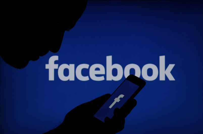 A Facebook logo is seen on a smartphone in this photo illustration on November 15, 2017. (Photo by Jaap Arriens/NurPhoto)