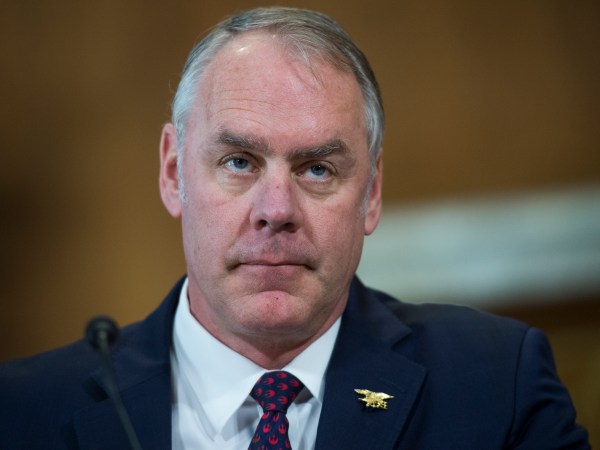 UNITED STATES - MARCH 13: Interior Secretary Ryan Zinke prepares to testify before a Senate Energy and Natural Resources Committee hearing in Dirksen Building on the department's FY2019 budget on March 13, 2018. (Photo By Tom Williams/CQ Roll Call)