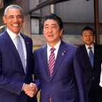 Former U.S. President Barack Obama and Japanese Prime Minister Shinzo Abe pose for photographers in front of Japanese Sushi restaurant in Tokyo's Ginza shopping district, Sunday, March 25, 2018. (AP Photo/Shizuo Kambayashi, Pool)