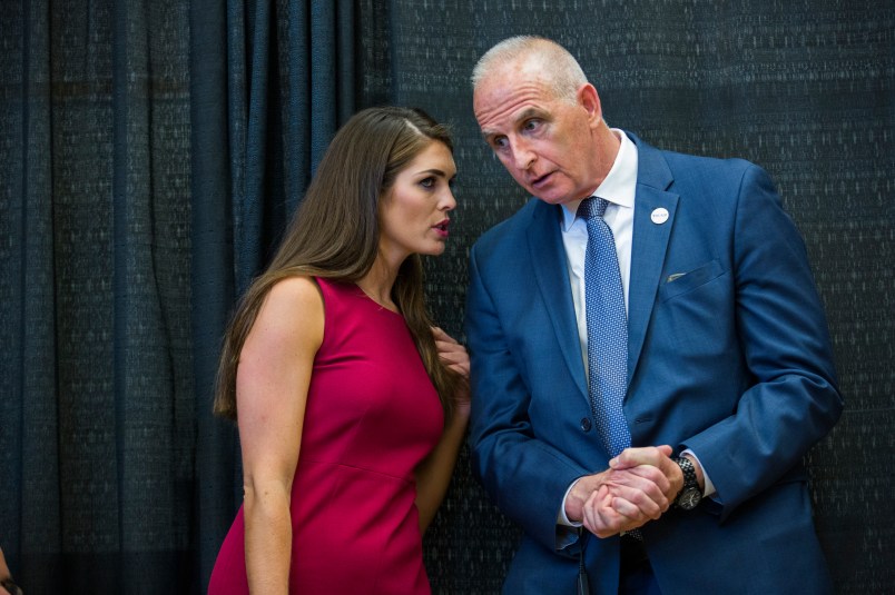 DERRY, NH  - AUGUST 19:   Hope Hicks is Republican Presidential candidate Donald Trump's campaign spokeswoman,  speaks with with head of security Keith Schiller, at a campaign event,  August 19, 2015 in Derry, NH.  (Photo by Brooks Kraft/ Getty Images)