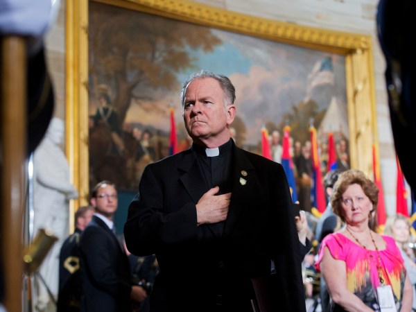 UNITED STATES - APRIL 11: Rev. Patrick Conroy, Chaplain of the House, attends the 2013 National Days of Remembrance ceremony in the Capitol rotunda to honor the victims of the Holocaust. (Photo By Tom Williams/CQ Roll Call)