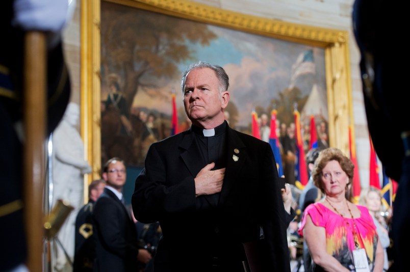 UNITED STATES - APRIL 11: Rev. Patrick Conroy, Chaplain of the House, attends the 2013 National Days of Remembrance ceremony in the Capitol rotunda to honor the victims of the Holocaust. (Photo By Tom Williams/CQ Roll Call)