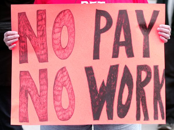 DETROIT, MI - MAY 3: Barbara Maxwell of Novi, Michigan, a teacher at Detroit's Earhart Elementary Middle School, participates in a Detroit teachers sick-out, the second in the past two days, and protests in front of Detroit Public Schools headquarters,   May 3, 2016 in Detroit, Michigan. The sick-out forced the closing of 94 of 97 Detroit school districts today. The teachers are looking for a guarantee that they will be paid for the work they perform.  (Photo by Bill Pugliano/Getty Images) ***  ***