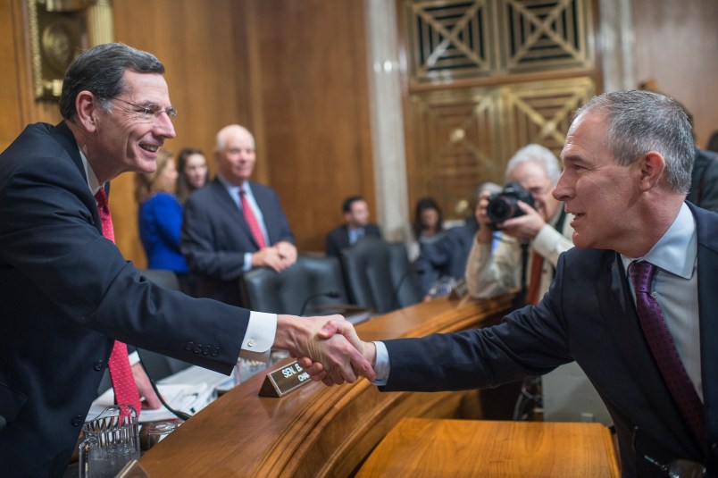 UNITED STATES - JANUARY 18: Chairman John Barrasso, R-Wyo., left, greets Scott Pruitt, President-elect Trump's nominee to be administrator of the Environmental Protection Agency, before his Senate Environment and Public Works Committee confirmation hearing in Dirksen Building, January 18, 2017. (Photo By Tom Williams/CQ Roll Call)