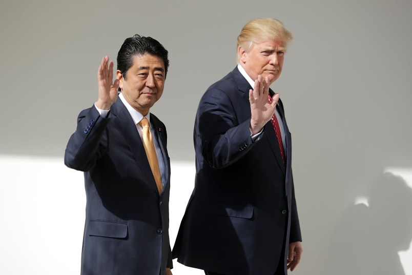 (AFP OUT) U.S. President Donald Trump and Japanese Prime Minister Shinzo Abe pose for photographs before bilateral meetings in the Oval Office at the White House February 10, 2017 in Washington, DC. Trump and Abe are expected to discuss many issues, including trade and security ties and will hold a joint press confrence later in the day.
