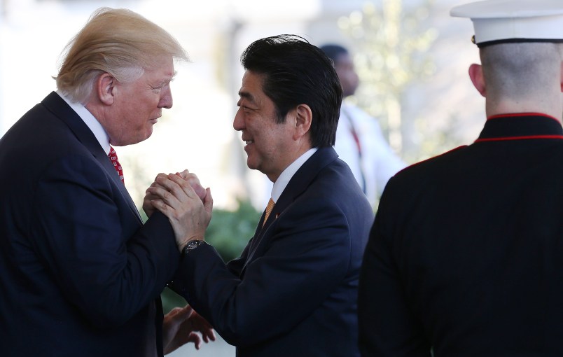 WASHINGTON, DC - FEBRUARY 10:  President Donald Trump (L) greets Japanese Prime Minister Shinzo Abe as he arrives at the White House on February 10, 2017 in Washington, DC. The two will hold a bilateral meeting and press conference today at the White House.  (Photo by Mario Tama/Getty Images)