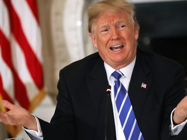 U.S. President Donald Trump conducts a meeting with state and local officials to unveil his administration's long-awaited infrastructure plan in the State Dining Room at the White House February 12, 2018 in Washington, DC. The $1.5 trillion plan to repair and rebuild the nation's crumbling highways, bridges, railroads, airports, seaports and water systems is funded with $200 million in federal money with the remaining 80 percent coming from state and local governments.