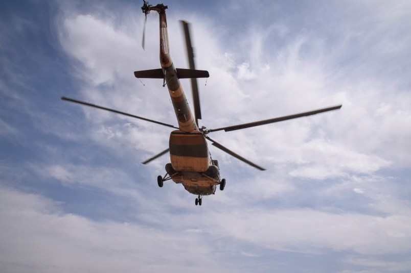 BOLO BLUK (DISTRICT), FARAH, AFGHANISTAN - 2018/03/08: An Mi-17 transport helicopter of the Afghan Air Force approaches for landing on the main road in the desert of Bolo Bluk district, Farah province, Afghanistan (8th of March 2018). The Mi-17 arrived to pick up the bodies of four Commandos that were killed in an operation against the Taliban the night before.Airpower is seen as a decisive advantage of Afghan government forces and their international backers over the insurgency, reaching enemies or own troops in even the remotest areas of the rugged, mountainous and underdeveloped country. These pictures show some of the military aircraft in Afghanistan’s skies – from large transport planes to U.S. drones. (Photo by Franz J. Marty/SOPA Images/LightRocket via Getty Images)