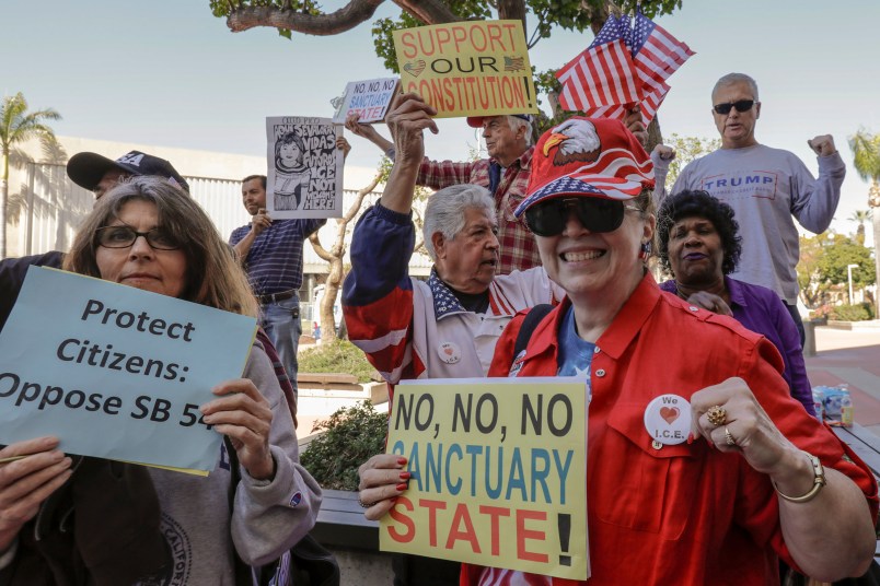 SANTA ANA CA MARCH 27, 2018 --- People opposing SB-54 celebrate. The Orange County Board of Supervisors approved a resolution to condemn the state's sanctuary laws. They also voted to join the Feds in their lawsuit against State of California. (Irfan Khan / Los Angeles Times)