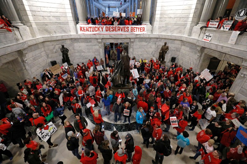 FRANKFORT, KY-APRIL 2: Public school teachers and their supporters protest against a pension reform bill in the rotunda of the Kentucky State Capital April 2, 2018 in Frankfort, Kentucky. The teachers are calling for higher wages and are demanding that Kentucky Gov. Matt Bevin veto a bill that overhauls their pension plan. (Bill Pugliano/Getty Images)
