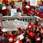 FRANKFORT, KY-APRIL 13: Kentucky Public school teachers protest outside the Kentucky House Chamber as they rally for a "day of action" at the Kentucky State Capitol to try to pressure legislators to override Kentucky Governor Matt Bevin's recent veto of the state's tax and budget bills April 13, 2018 in Frankfort, Kentucky. The teachers also oppose a controversial pension reform bill which Gov. Bevin signed into law. (Photo by Bill Pugliano/Getty Images)