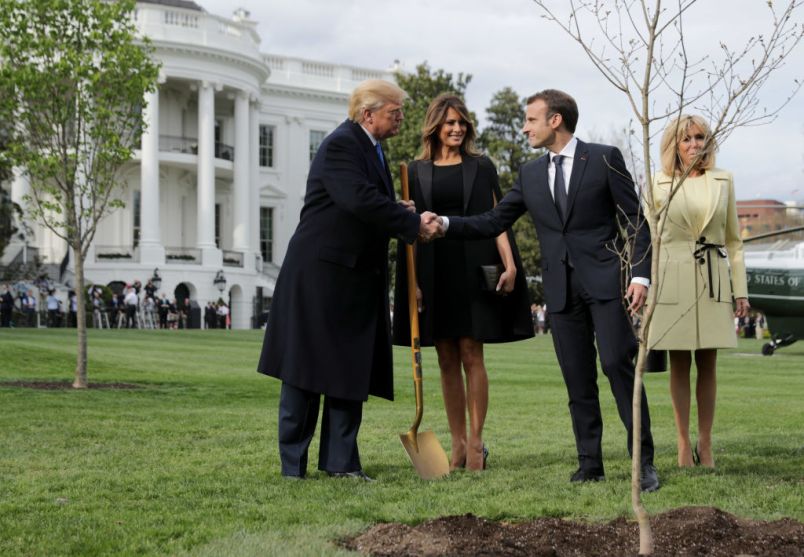 WASHINGTON, DC - APRIL 23:  U.S. President Donald Trump, U.S. first lady Melania Trump, French President Emmanuel Macron and his wife Brigitte Macron participate in a tree-planting ceremony on the South Lawn of the White House April 23, 2018 in Washington, DC. The European Sessile Oak is a gift from the Macrons and comes from Belleau Woods, where more than 9,000 American marines died in June 1918 during the First World War. According to the first lady's office "The forest is a memorial site and important symbol of the sacrifice the United States made to ensure peace and stability in Europe." (Photo by Chip Somodevilla/Getty Images)