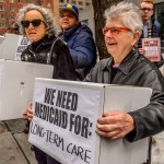 NYC FEDERAL BUILDING AT 26 FEDERAL PLAZA, NEW YORK, NY, UNITED STATES - 2017/03/21: Protesters holding boxes with a print on it. Outside the NYC Federal Building (26 Federal Plaza, Bway between Worth and Duane), which contains Medicaid offices, hundreds of New Yorkers who rely on Medicaid, including seniors and people with disabilities, will conduct political theater to protest congressional Republicans' plan to remake Medicaid. (Photo by Erik McGregor/Pacific Press/LightRocket via Getty Images)