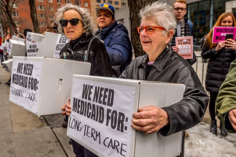 NYC FEDERAL BUILDING AT 26 FEDERAL PLAZA, NEW YORK, NY, UNITED STATES - 2017/03/21: Protesters holding boxes with a print on it. Outside the NYC Federal Building (26 Federal Plaza, Bway between Worth and Duane), which contains Medicaid offices, hundreds of New Yorkers who rely on Medicaid, including seniors and people with disabilities, will conduct political theater to protest congressional Republicans' plan to remake Medicaid. (Photo by Erik McGregor/Pacific Press/LightRocket via Getty Images)