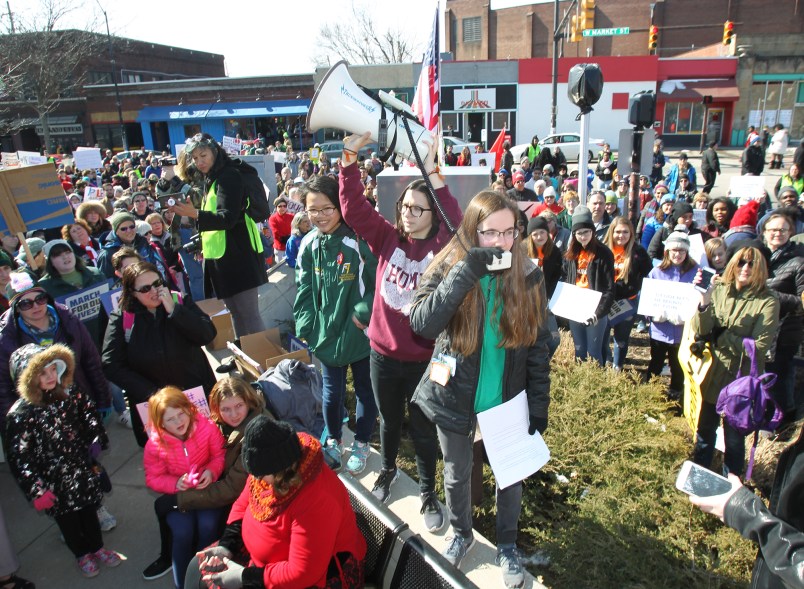 Meredith Gallagher, 15, of Cuyahoga Falls, the organizer of the Akron March for Our Lives event to end gun violence, yells into the microphone as she leads a rally at Highland Square in Akron, Ohio, on Saturday, March 24, 2018. (Karen Schiely/Akron Beacon Journal/TNS)