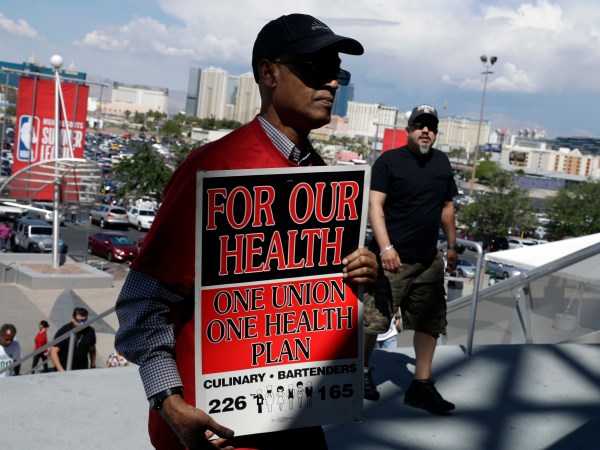 Culinary Union members file into a university arena to vote on whether to authorize a strike Tuesday, May 22, 2018, in Las Vegas. (AP Photo/Isaac Brekken)