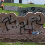 Swastikas were spray-painted on at least 150 headstones and grave markers at a cemetery in Glen Carbon on Saturday, May 26, 2018. Police said swastikas were also spray-painted on several homes nearby. (Photo by Laurie Skrivan/Post-Dispatch)