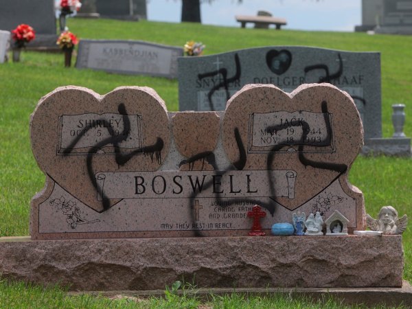 Swastikas were spray-painted on at least 150 headstones and grave markers at a cemetery in Glen Carbon on Saturday, May 26, 2018. Police said swastikas were also spray-painted on several homes nearby. (Photo by Laurie Skrivan/Post-Dispatch)