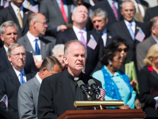 UNITED STATES - SEPTEMBER 11: Reverend Patrick J. Conroy,Chaplain of the U.S. House of Representatives, speaks on the East Front steps of the Capitol during the 9/11 Congressional Remembrance Ceremony on Tuesday, Sept. 11, 2012. (Photo By Bill Clark/CQ Roll Call)