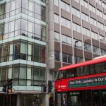 A London bus with an ad for dirty washing drives past the offices of Cambridge Analytica on New Oxford Street, the UK tech company accused of harvesting the personal details of Facebook users in its data privacy scandal, on 11th April, 2018, in London, England. (Photo by Richard Baker / In Pictures via Getty Images)